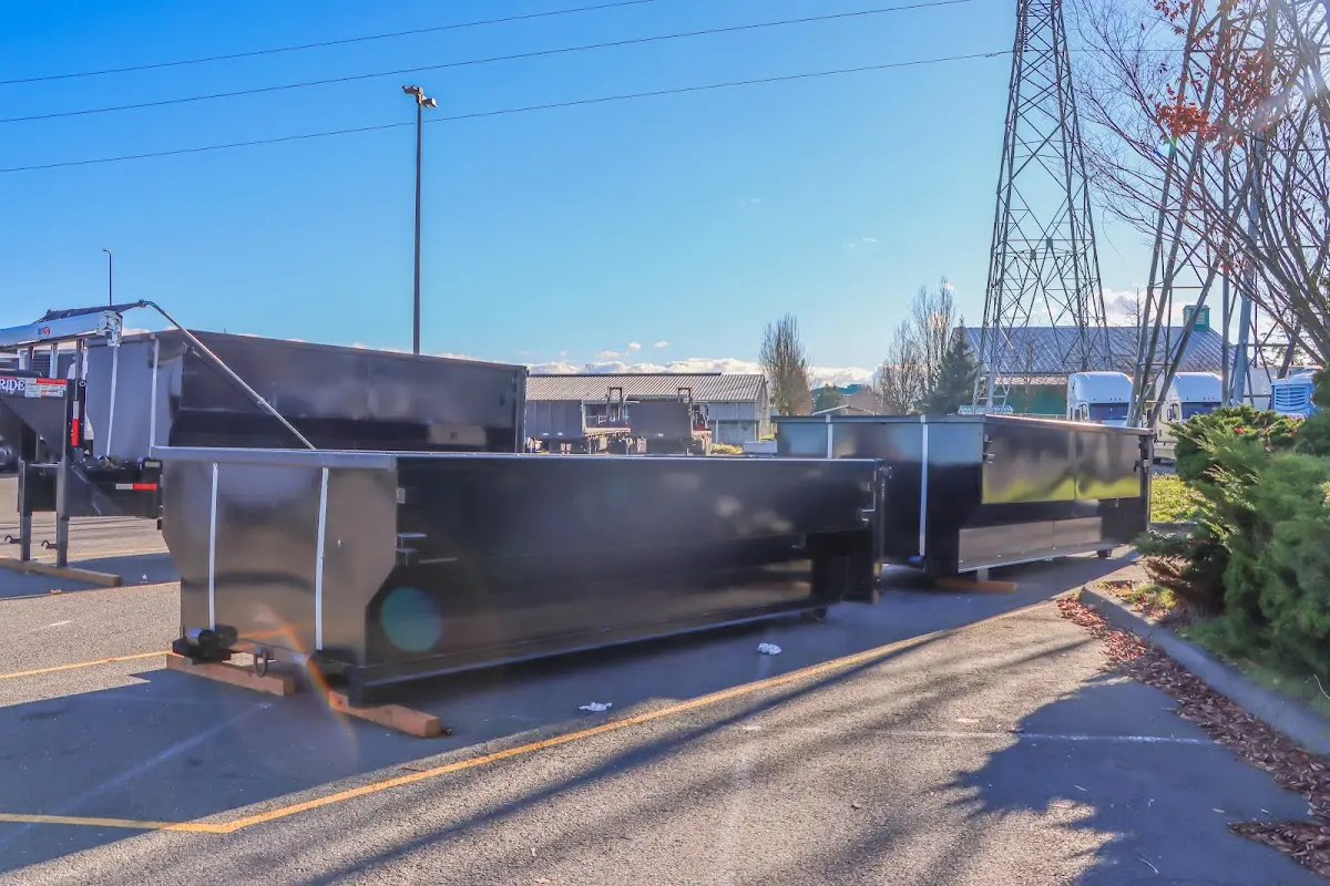 Roll-off dumpster ready for waste disposal at job site for Concrete Dumpster Rental in Garfield